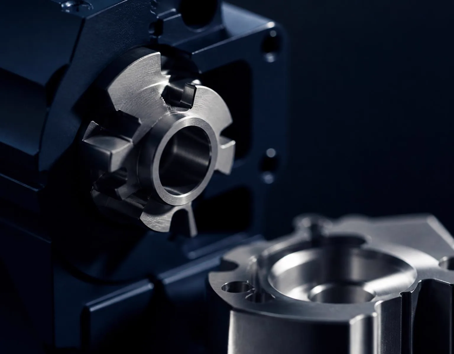 Interlocking brushed steel components in a precision-machined assembly